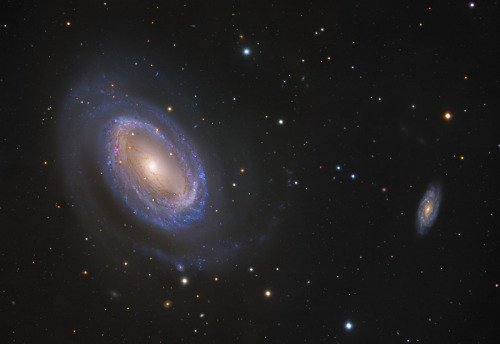 While most spiral galaxies have two or more arms, NGC 4725 only has one.  In both photos, a more tra