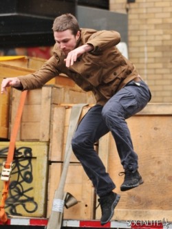 socialitelife:  SEXY Stephen Amell, Arrow star, caught shooting an action scene in Vancover today. 