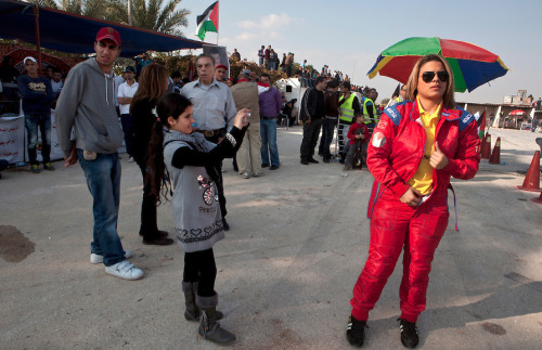 5centsapound:  Tanya Habjouq: Ladies Who Rally *This photo series is from a few years earlier, but Al Jazeera posted an article on the ‘Speed Sisters’ today.   Ramallah, Occupied West Bank - Hundreds of people have gathered along a closed-off street