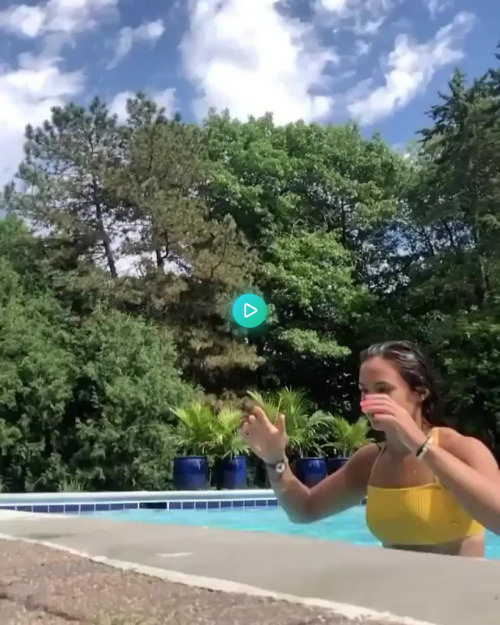 Jumping out of a pool. To see the hottest