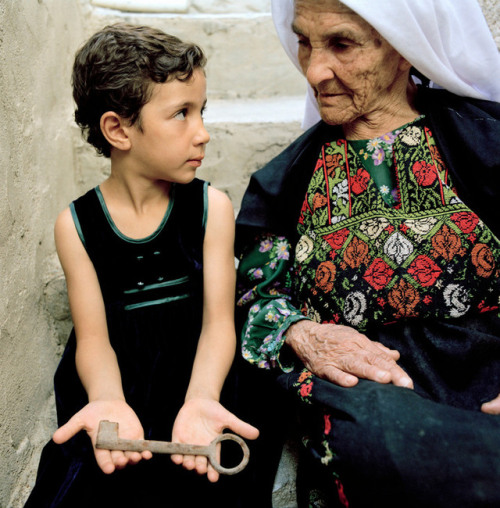 nnnorthaaafrican:PALESTINE .West Bank. 2003. Aida refugee camp. Fatima Im IBRAHIM with granddaughter