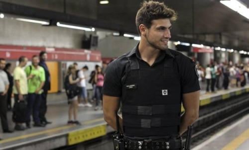 morningcupofaboveaveragejoe:  Meet Guilherme Leão. He’s 22 and works as a subway security guard in São Paulo, Brazil. He became a web celebrity after being voted the hottest guard. Fans have been stopping him for photos, making his daily rounds impossible