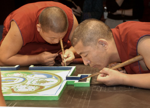 freersackler:  In response to the September 11 tragedies, twenty Buddhist monks from the Drepung Loseling Monastery constructed a sand mandala (sacred painting) at the Sackler in 2002. This seven-foot-square mandala, one of the largest ever created in