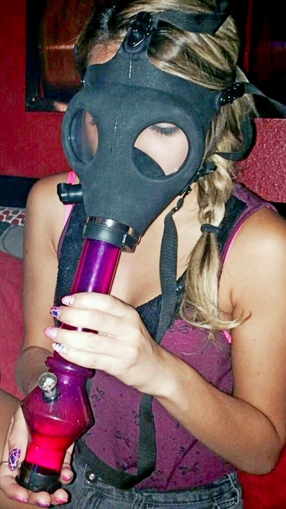erotic-maryjane:  Marina Angel hitting the gas mask bong which was on her table in