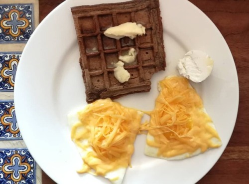 alittlebitofketo: Chocolate keto waffles, chevre and eggs (under all the cheese).#waffles #sugarfr