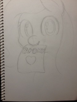 sketchashydaily:Requested by @mlpart-daily  “Can you draw Fluttershy with her holding a piece of paper in her mouth saying Brony ❤”  Sketch #2 for Day #212&lt;3