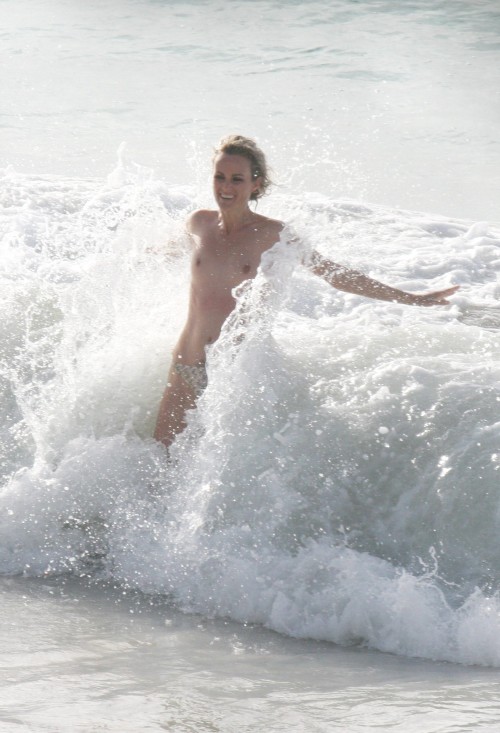toplessbeachcelebs:  Laeticia Hallyday (Model) swimming topless on the beach (August 2009) 