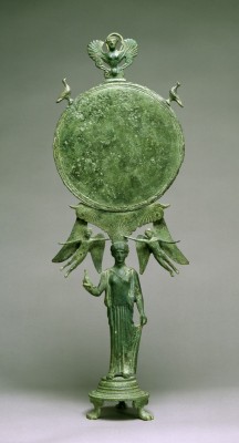 ancientart:  Mirrors of the ancient world.  These mirrors would have once been highly polished in order to provide a good reflection. The 1st shown is Classical Greek (ca. 460 BC): Caryatid Mirror with Aphrodite. The central female figure serves as the