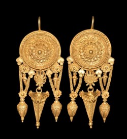 archaicwonder: Greek Gold  Earrings with Goddess Motifs, 4th Century BC A pair of gold earrings with central shield decorated with bead wire to the edges; within each shield a series of loops bordered by bead wire; to the center a rosette consisting