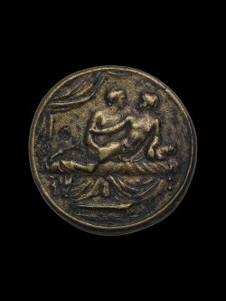 via-appia:  Copper alloy spintria. Male lovers on bed. The eromenos  (younger ‘beloved’, passive) is looking back at the erastes (older,  active lover) and reaches back to hold his partner’s upper arm / XV within wreath. Roman, 1st century 