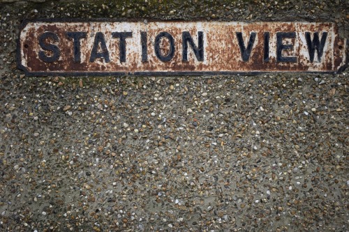 Rusting original street sign incorporated into a garden wall, Station View, Greenford, London Boroug