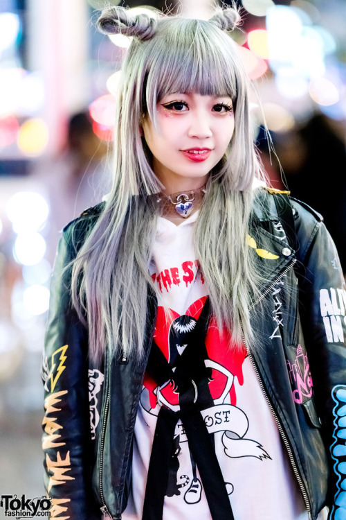 Japanese singer and model Asachill on the street in Harajuku at night wearing a Joyrich jacket over 