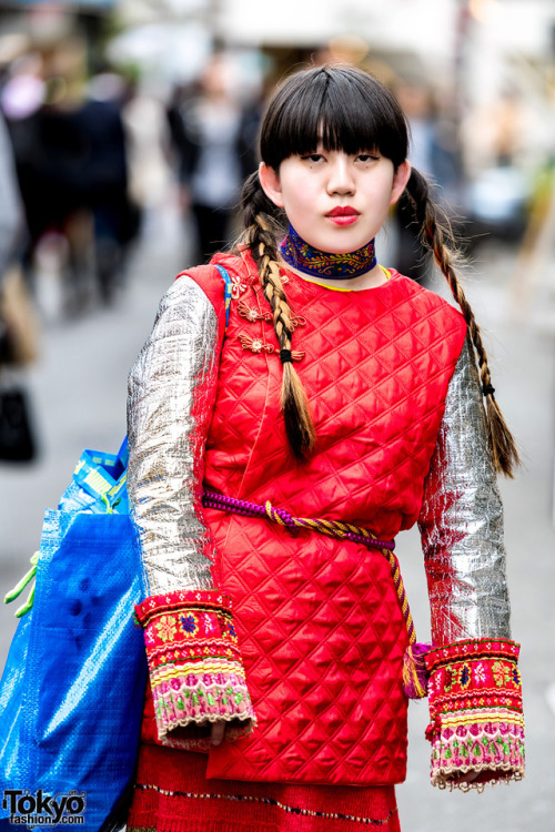 19-year-old Japanese student Risa on the street in Harajuku wearing a handmade quilted top with meta