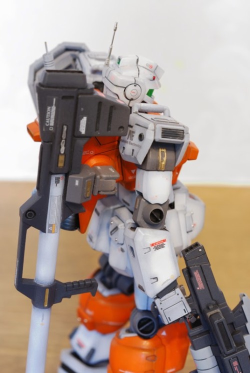 galaxyjunkyard:  hangmen13:  Powered GM custom built by clubmanKS Base Gunpla: HGUC 1/144 Powered GM  Another stunning Gundam custom, and we love the orange. 
