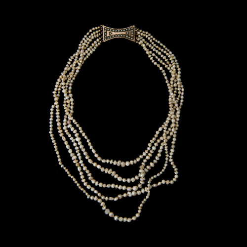 thinkingimages: A PEARL NECKLACE, seed pearls, clasp 9K gold, early 19th century.Five strands, lengt