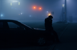 fruitgod:  haemus:  He sat on the peeling hood of the car, breathing the frigid air that stung if he took too much of it in. The fog had oozed in about 40 minutes ago, dampening sight and sound. It made him nervous. Every so often, green light flashed