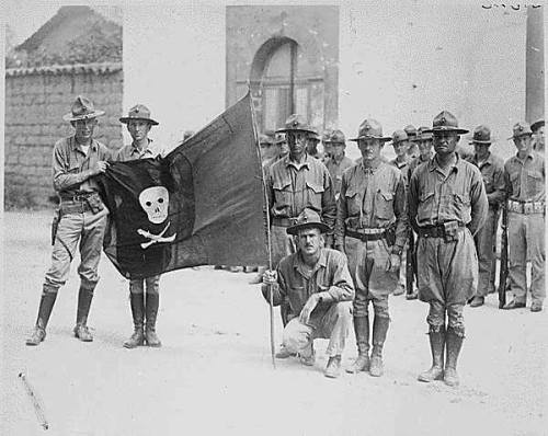 United States Marines with the captured flag of Augusto César Sandino of Nicaragua in 1932
