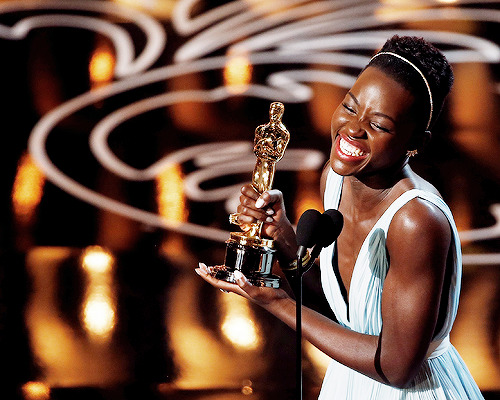 delevingned-deactivated20151023:  Lupita Nyong’o accepts the Best Performance by an Actress in a Supporting Role award for ‘12 Years a Slave’ during the 86th Annual Academy Awards 