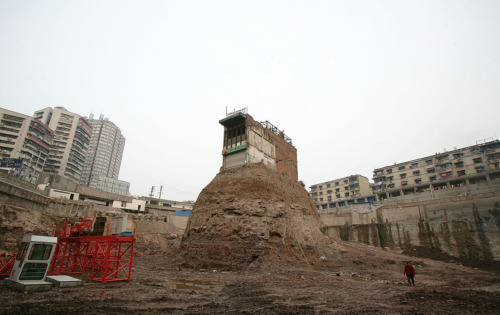 theatlantic:  Read more:And Then There Was OneAcross China, where new developments are keeping pace with the rapidly growing economy, reports continue to surface so-called “nail houses.” These properties, standing alone amid the ruins of other buildings,