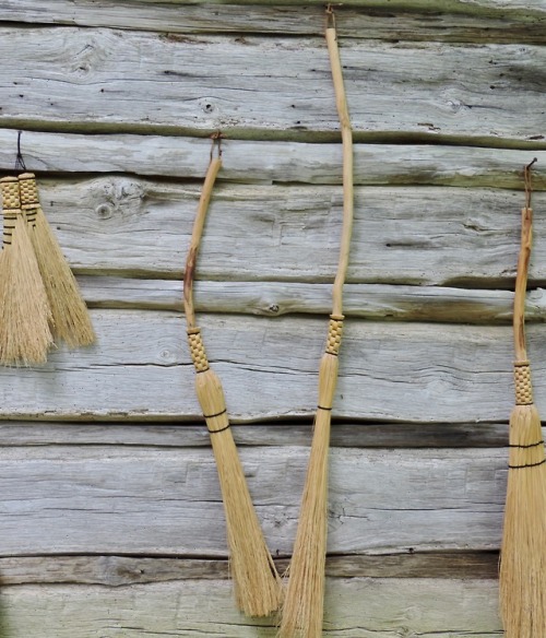 Straw Brooms Hanging on a Rough-Hewn Log Wall, Meadows of Dan, Patrick County, 2014.