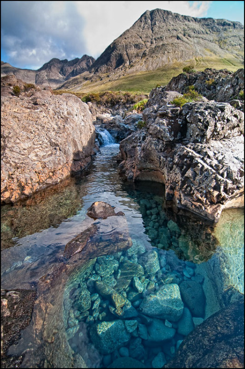 madeofpatterns:  odditiesoflife:  The Fairy Pools on the Isle of Skye The stunning rock formations caused by erosion from the crystal clear water running down from the Cullins, the largest mountains on the Isle of Skye in Scotland, created the legendary