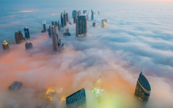  Foggy Dubai Picture: This breathtaking view from the Burj Khalifa, the world’s tallest building, shows a thick blanket of smoggy fog smothering Dubai. The mist almost completely covers the skyscrapers which dominate the skyline. © Bjoern Lauen/Solent