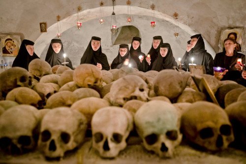 Romanian Orthodox nuns sing in the ossuary at the Pasarea Monastery, outside Bucharest, Romania on M
