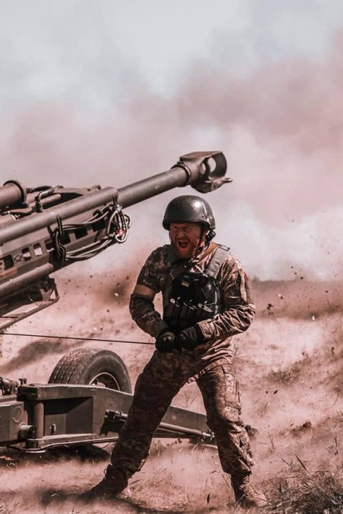 Ukrainian Soldier Operates An American M777 Howitzer.