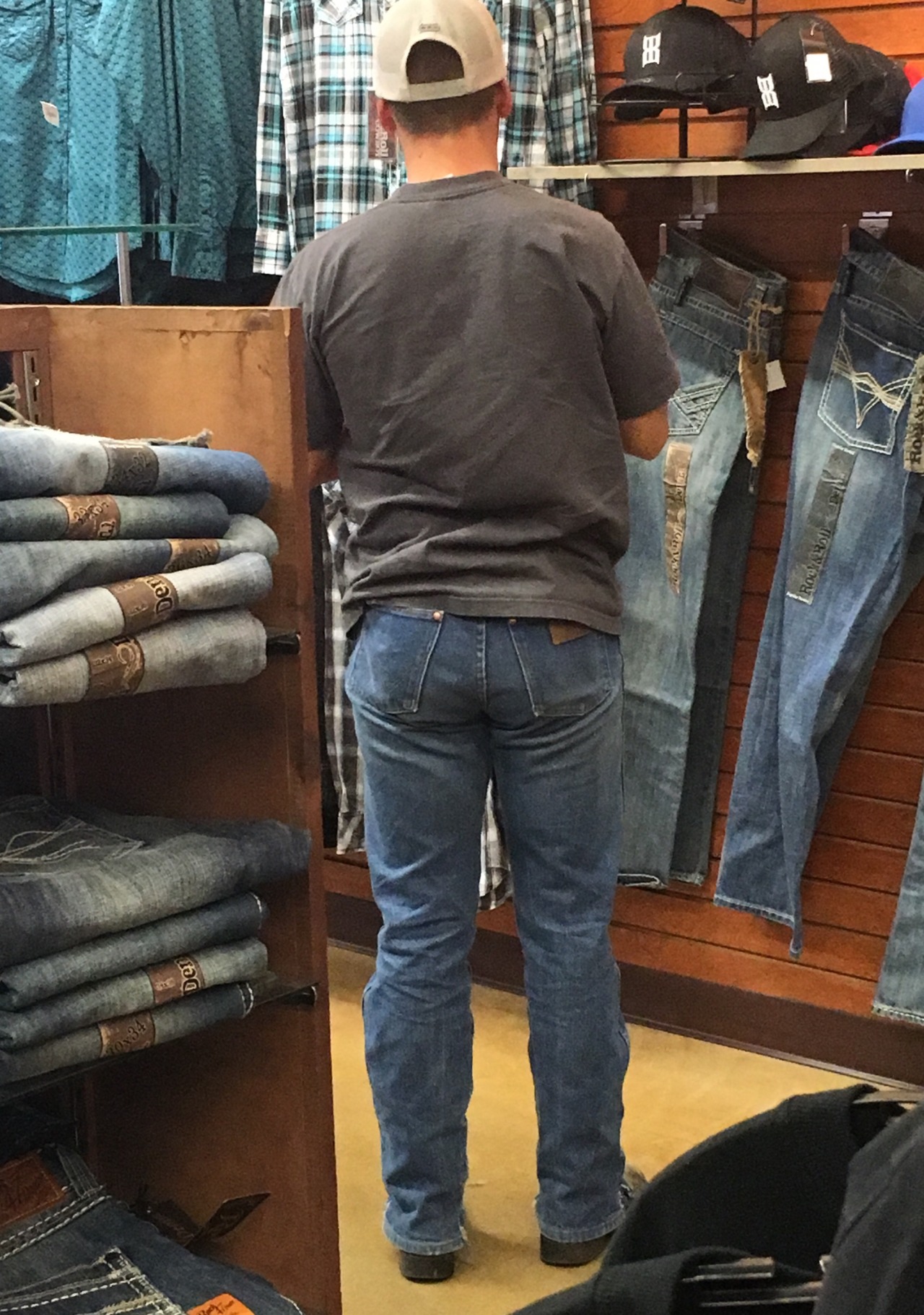 cowboysandsoldiers:  Hot young cowboy with a great Wrangler ass browsing around in