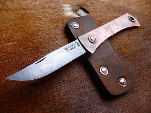 ru-titley-knives: Rustic style pocket slip for a pimped copper Opimod .  Custom knives , sheaths and