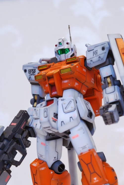 galaxyjunkyard:  hangmen13:  Powered GM custom built by clubmanKS Base Gunpla: HGUC 1/144 Powered GM  Another stunning Gundam custom, and we love the orange. 