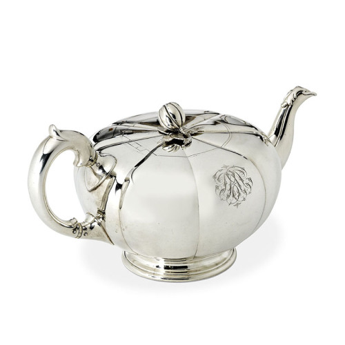 A Silver Teapot by Robert Garrard, In the form of a stylised melon with reeded sides, the finial in 