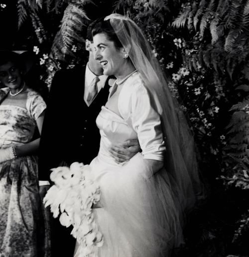 April 26, 1954 - Patricia Kennedy is seen at her wedding to actor Peter Lawford. Jean Kennedy can be