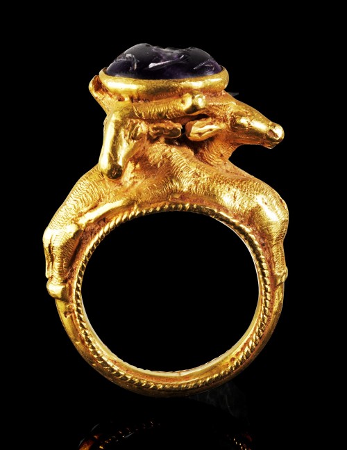 archaicwonder: Greek Gold and Amethyst Ring, 1st Century BC Ring with 3 gazelles on the hoop holding