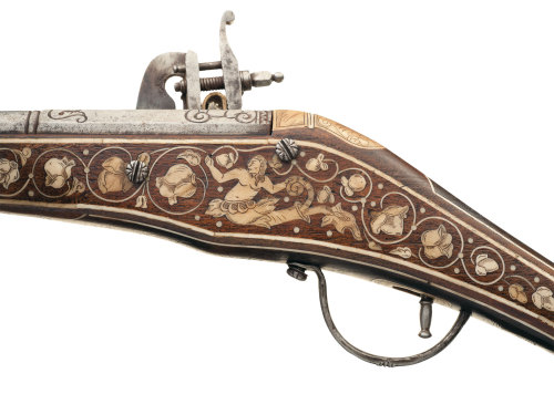 A very lovely 16th or 17th century wheel-lock pistol with scrimshaw decorated ivory stock inlays.