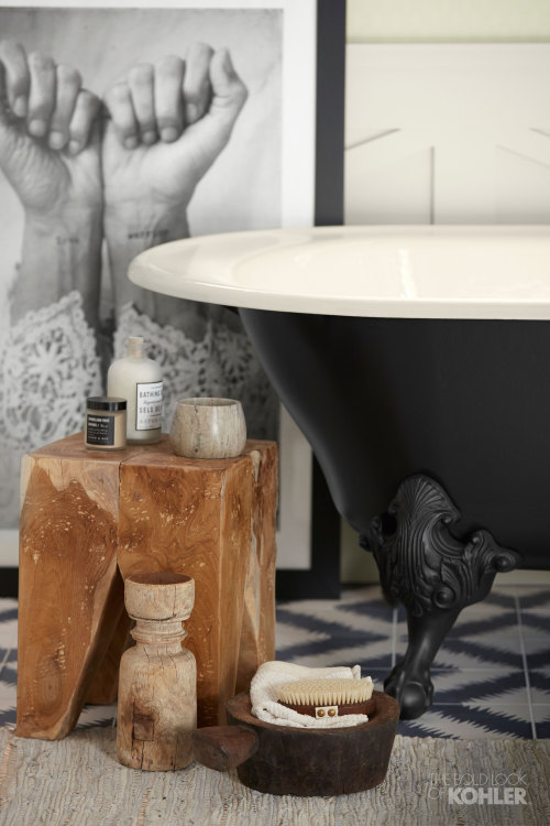  A handcrafted freestanding bath with claw feet adds a vintage flair and craftsmanship to the space.