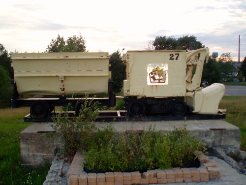 Mine Rail Car With Mine Smokestack in the Distance, Flin Flon, Manitoba, Canada, 2006.