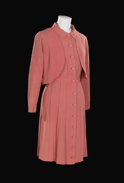 A pink crepe wedding dress, worn by Gladys Masen in 1939.Clothes rationing and fabric shortages made