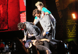  the boys trying to do a human pyramid only