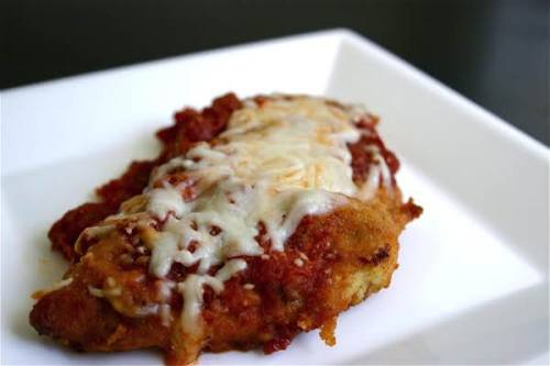 Chicken Parmesan, in its purest form, consists of breaded chicken, seasoned with an Italian Blend, c