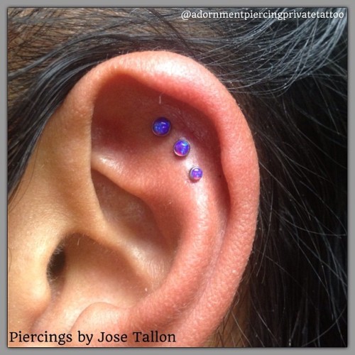 Fresh Triple helix piercings by Jose Tallon at @adornmentpiercingprivatetattoo (760)565-2267 with #neometal #titanium body jewelry with purple opal cabochons threadless ends 3mm, 2.5, 2mm. #adornmentpiercingprivatetattoo #josetallon