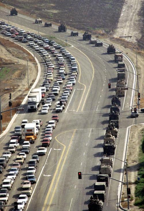communard-julio:  The last time the National Guard was called in was in 1992, during the Los Angeles Riots. Here they are advancing into the city. Solidarity with those fighting back in Baltimore all-day-long.