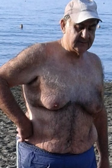 Hairy grandpa on the beach