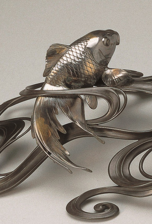 japaneseaesthetics:  Ornament of Fish in Waves (Okimono).  Japan, circa 1900.  Bronze, sil