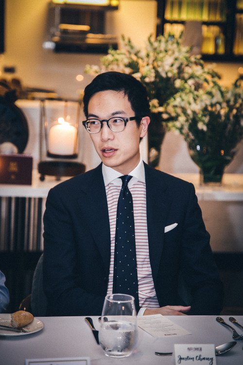 Justin Chang in his bespoke suit and horizontal stripe shirt with contrast collar.- Ascot Chang
