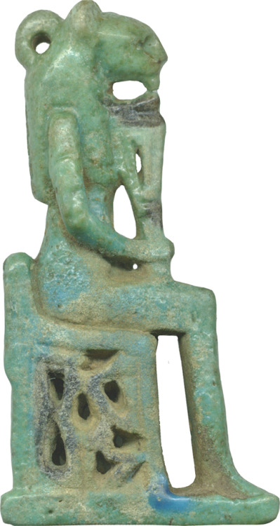 The lion-headed cat goddess Bastet, seated and holding a sistrum (rattle).  Ancient Egyptian amulet 