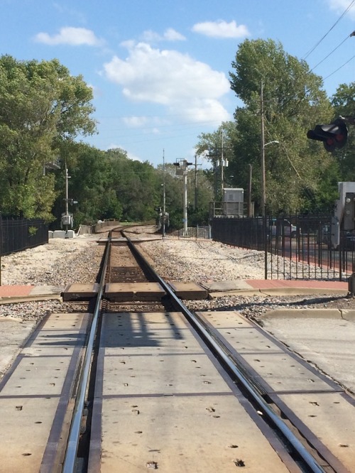 chavisory:Train pics for @into-the-weeds!a.) The railroad crossing in Parkville, MO. Still used by t