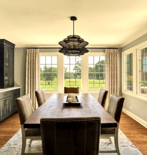 Transitional Dining RoomExample Of A Mid-sized Transitional Medium Tone Wood Floor Kitchen/dining Room