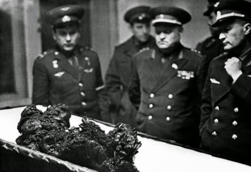 The remains of soviet cosmonaut Vladimir Komarov are viewed after his space capsule crashed upon ree