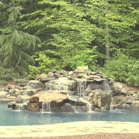Fountain New YorkMid-sized Modern Backyard Fountain Idea With Stamped Concrete And A Custom-shaped Pool